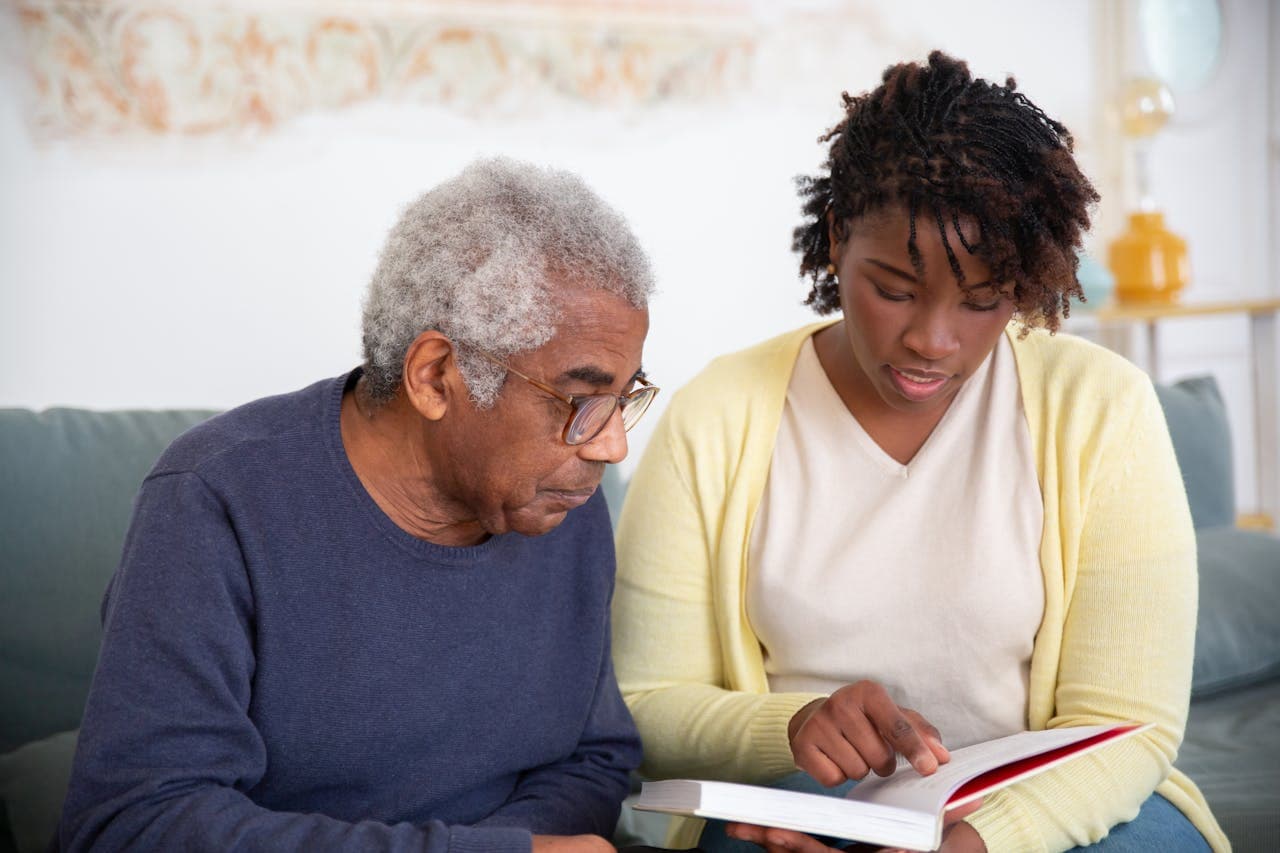 woman assisting elderly man